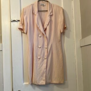 Narcissus, pink dress with open lapel collar and double buttons on the front. 13